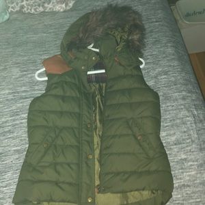 Army green puffy vest with faux fur snap on hood